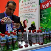 An Afghan trader pours juice samples for guests and buyers at the #Gulfood2017 in Dubai, February 27, 2017.