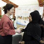 Deputy Chief of Mission Dorothy Shea meets a beneficiary at the Imbaba community hub for women and girls