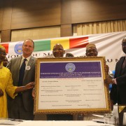 At the One Health Platform Launch, participants hold a  certificate