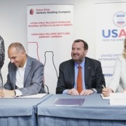 USAID and Coca-Cola representatives sign an agreement on partnership