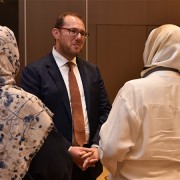 The Libya External Office Chargé d’Affaires a.i. Josh Harris speaks with participants at the Libya Women's Economic Empowerment Conference 