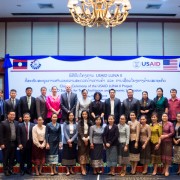 U.S. Ambassador Rena Bitter (top row, center) joins Minister of Industry and Commerce Khemmani Pholsena and 40 other representatives from the Lao government, the U.S. Embassy, and the private sector during the closing ceremony of the USAID LUNA II project in Vientiane.