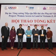 USAID/Vietnam Deputy Mission Director Craig Hart and ISDS Director Dr. Khuat Thu Hong with the community volunteers.