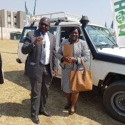 Minister Chilufya receives a set of car keys from Dr. Musumali after the handover of five 4x4 vehicles to assist the Ministry of Health’s expansion of maternal and child services across Zambia.