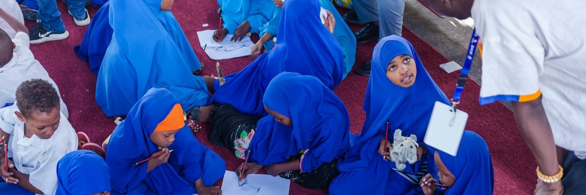 Students participate in a drawing workshop at the Mogadishu Book Fair. Ismail Taxta, UNICEF/Somalia