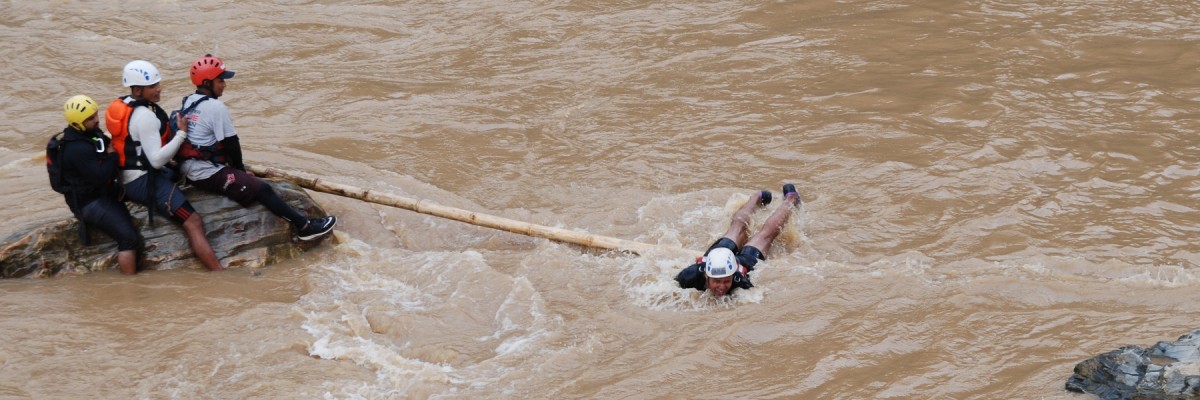 Trainees participate in a mock rescue drill during Swift Water Rescue Training. Photo by National Society for Earthquake Technology-- Nepal for USAID.